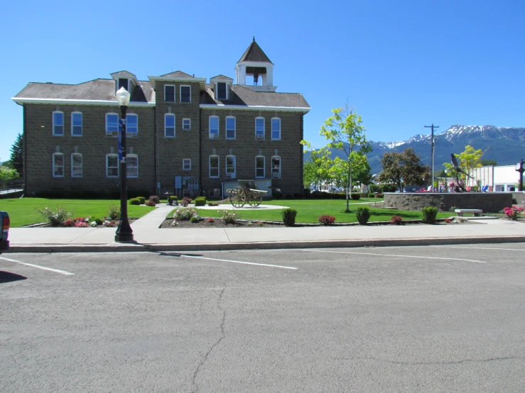 an older residential building is seen from across the street