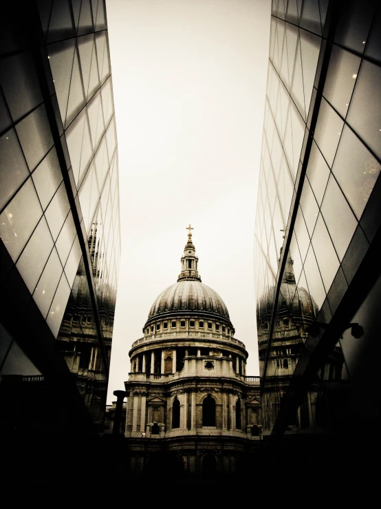 buildings reflected in the windows of their mirrored surfaces