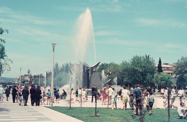 large outdoor water fountain set into a grassy area