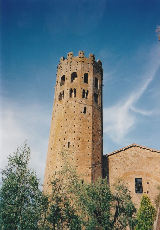 a tall tower that is sitting near trees