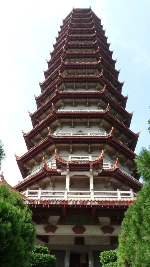 the tower is made of stone bricks and has many designs on the top