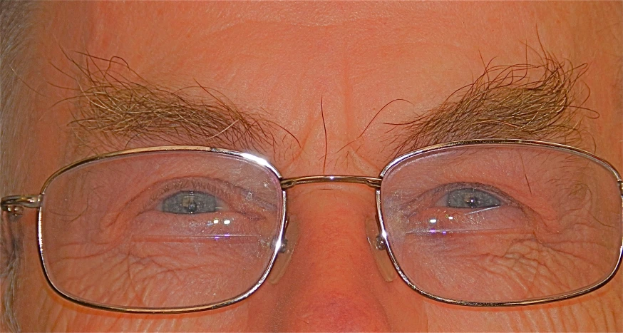 a close up of the upper part of a mans face