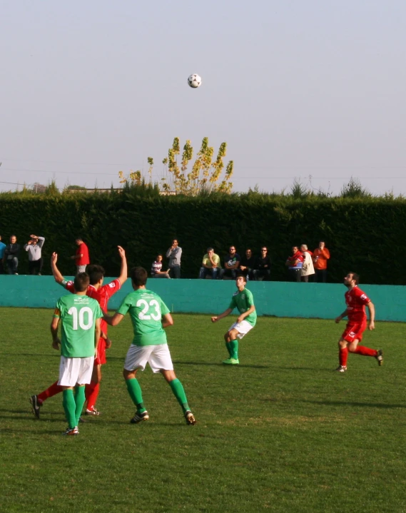a group of young men on a field playing soccer