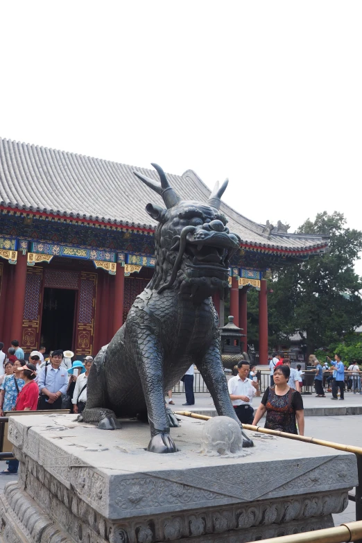 a statue is placed outside of a building