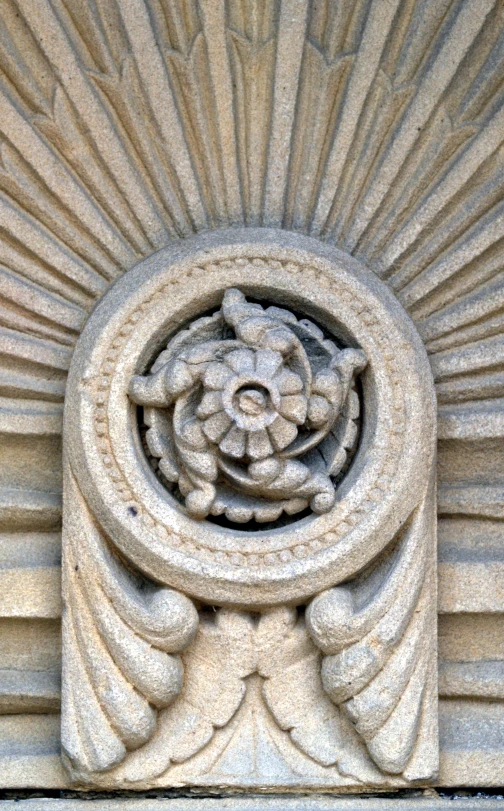 a close up of the face on the front side of a building