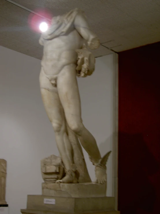 a statue that has a red light coming out of it