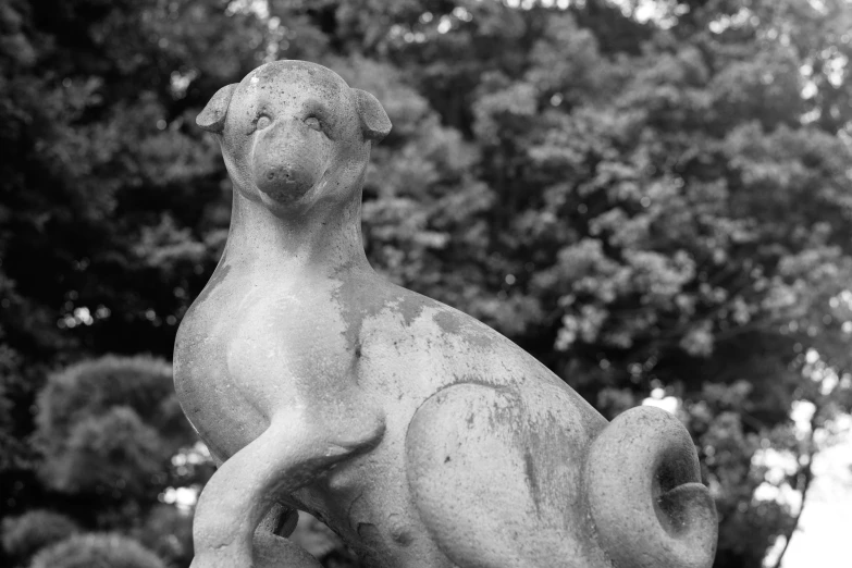 a stone dog figurine is seen in the foreground