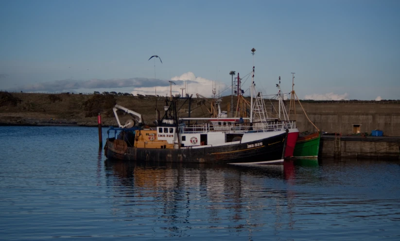 a boat on the water at the dock