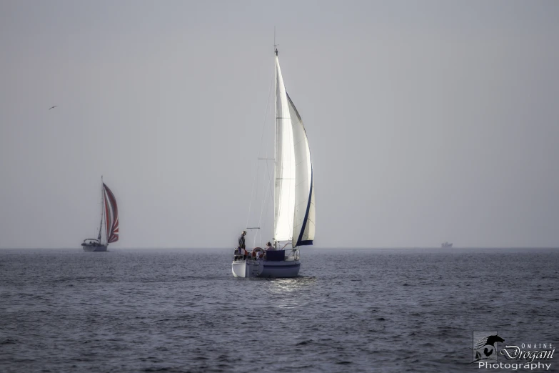 the sail boats are in the open ocean