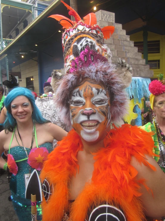 some women and guys are all dressed up in costumes