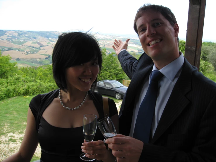 a man and woman who are holding wine glasses