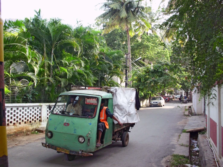 an auto rickshaw has covered up on the road