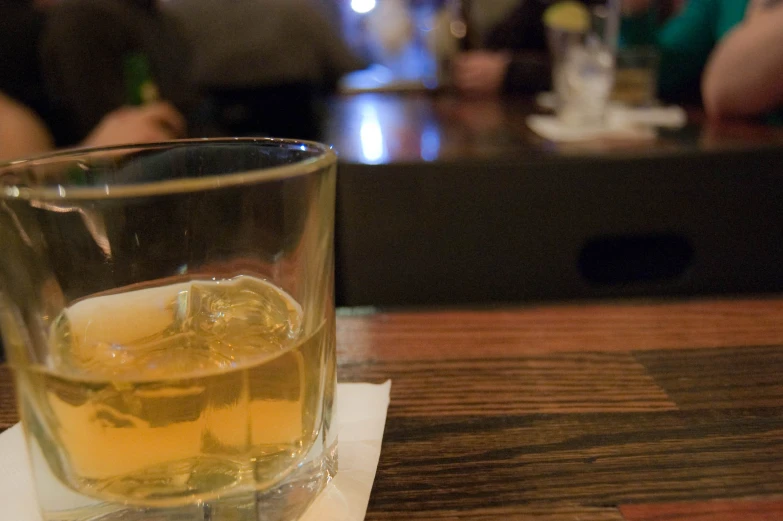 an alcohol drink sitting on top of a table