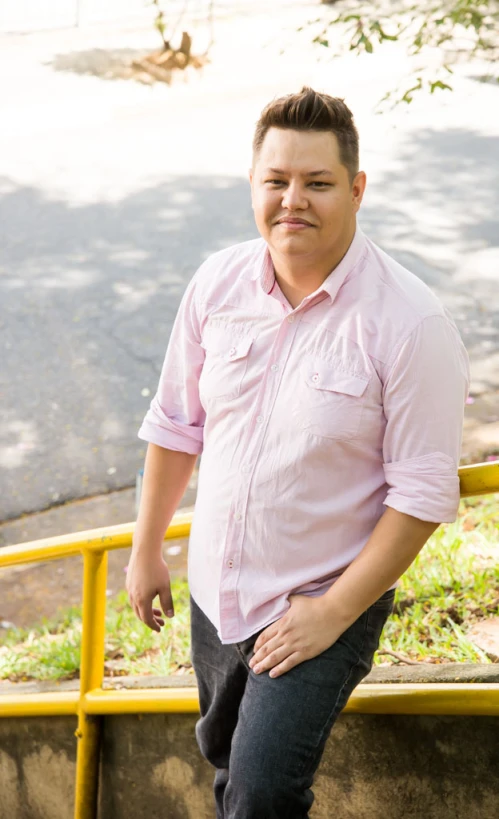 an obese man standing on a set of stairs