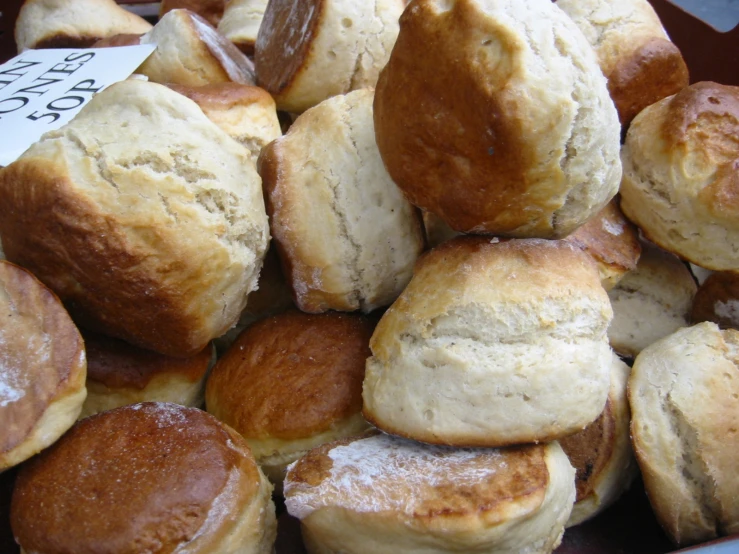 a basket of freshly made biscuits and other baked goods