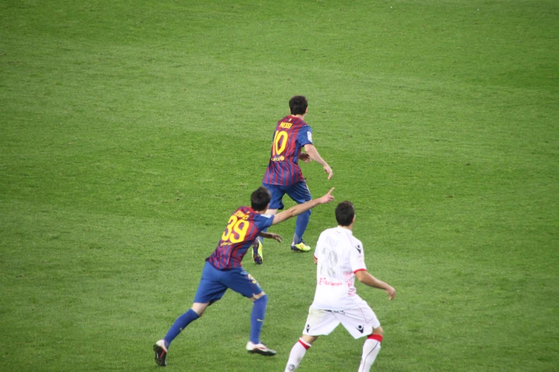 a group of young men playing a game of soccer