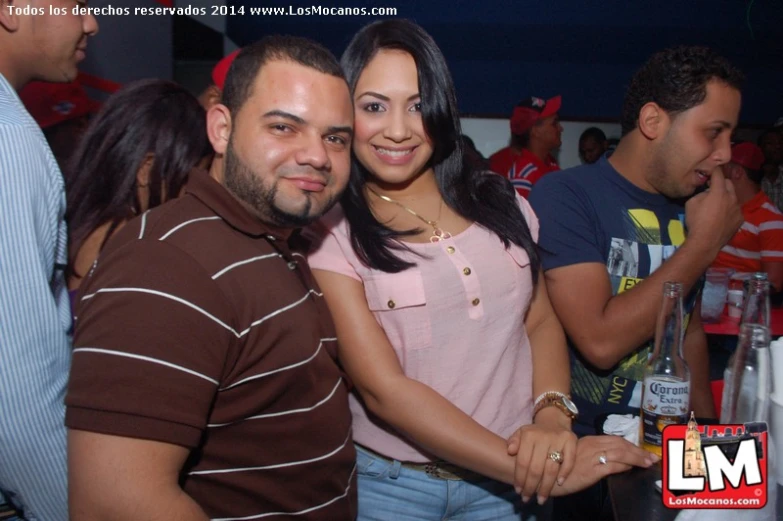 two smiling women and two men posing together