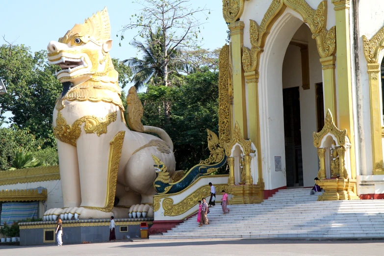 a large lion statue in front of a building