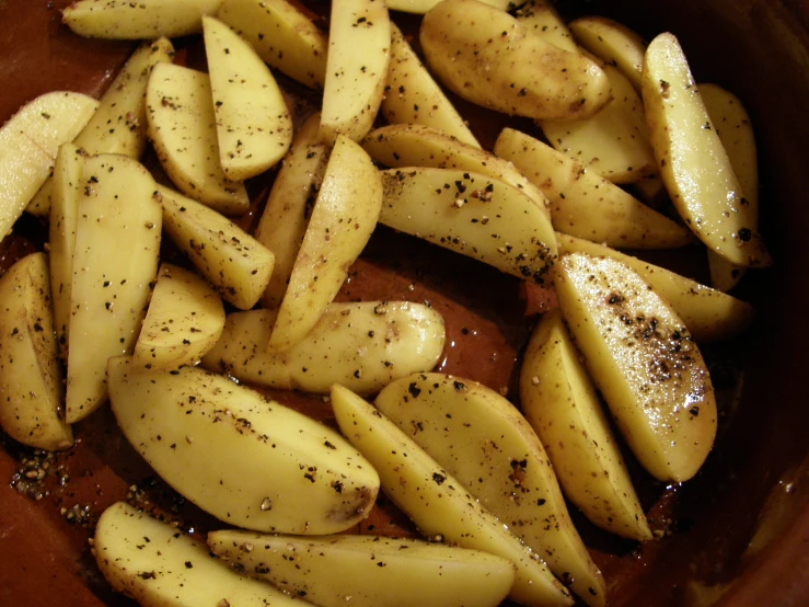 potatoes with some pepper and black pepper sprinkled on them