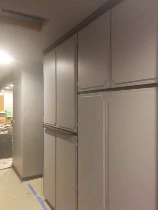 a refrigerator in the middle of a room