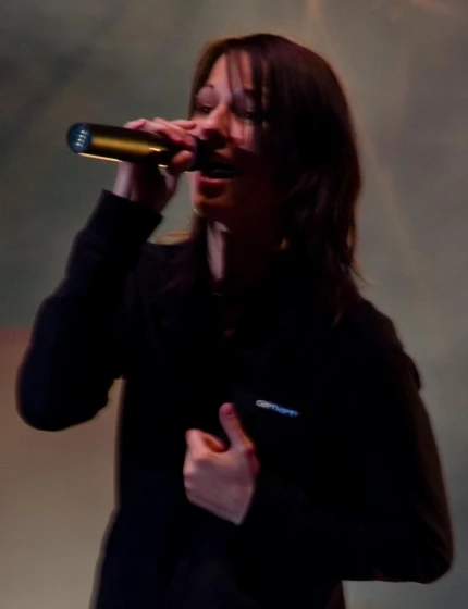a person holding a microphone to their mouth