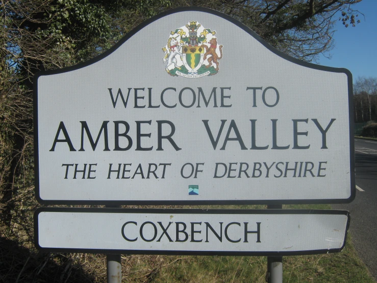 a sign for an amut park near the edge of a road