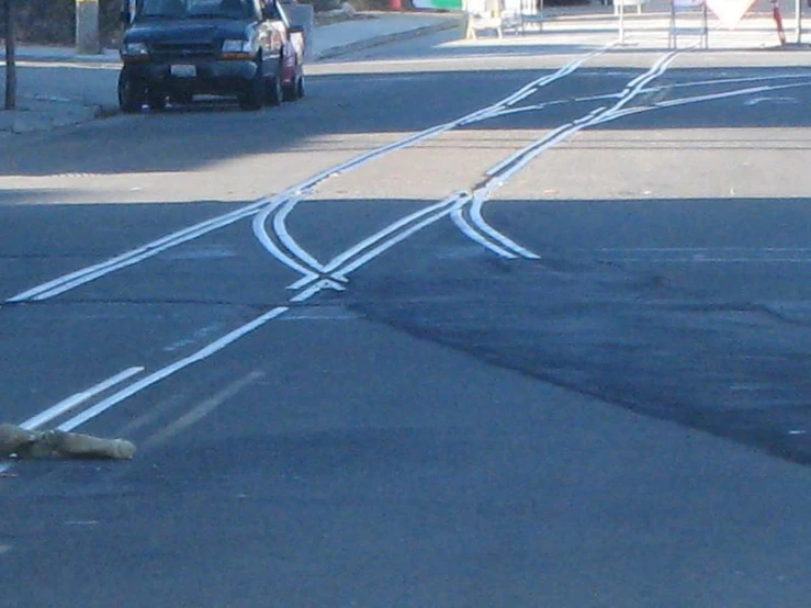 a black car in the distance on the street