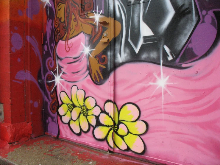 a pink wall with flowers and a painting of a black woman