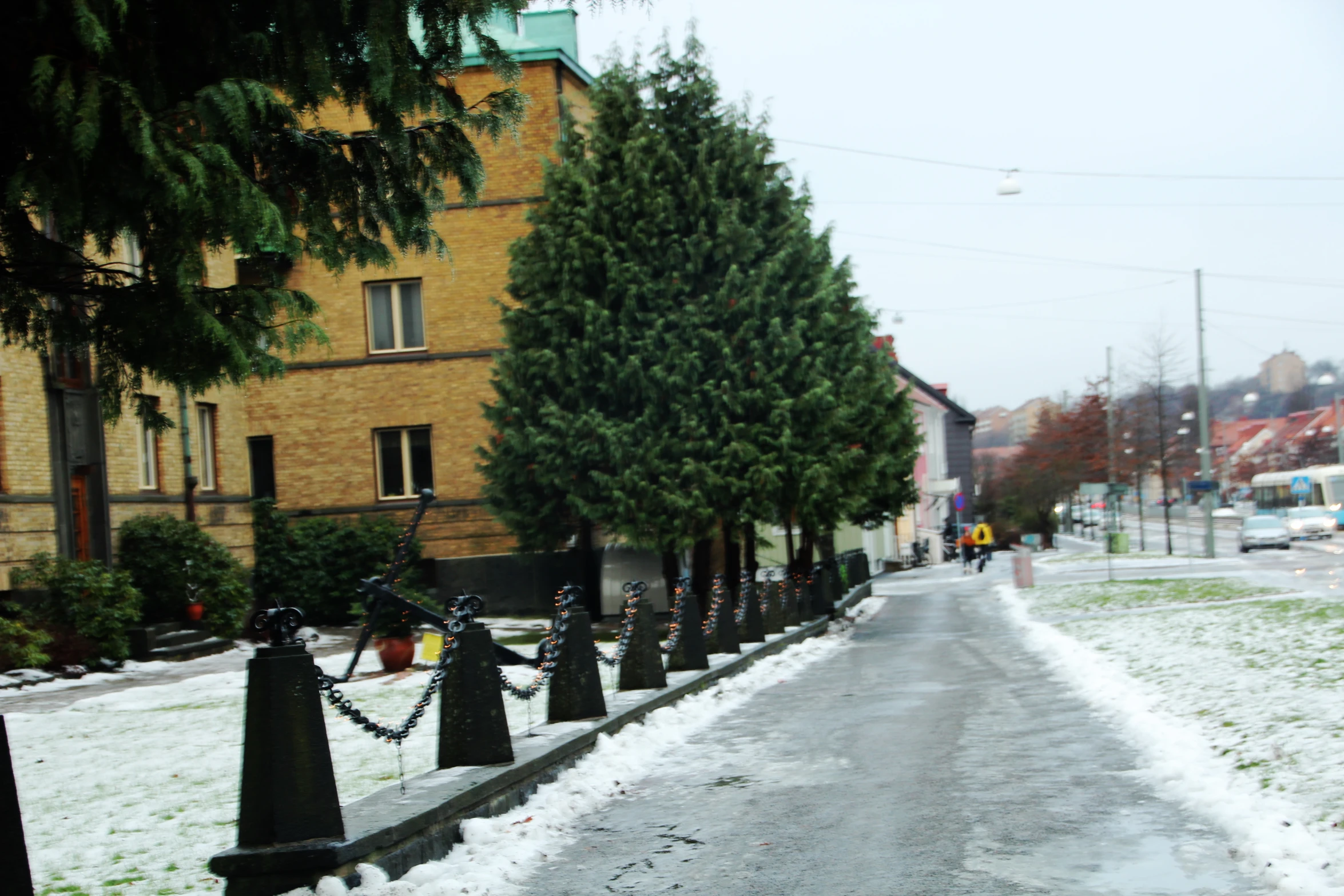 a small road is seen on a snowy day