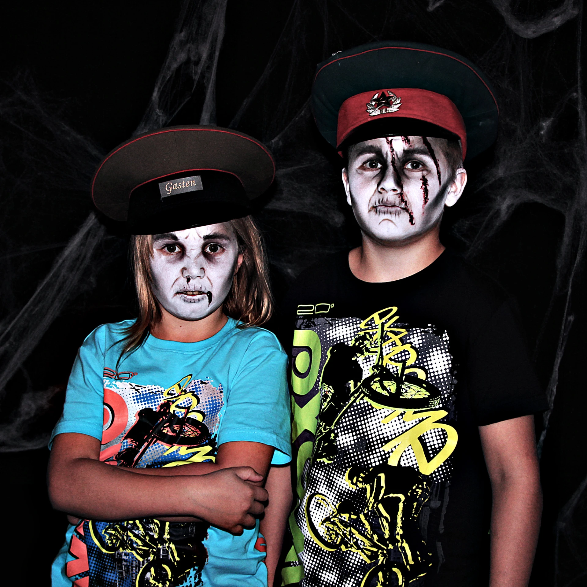 two young children dressed up in face paint