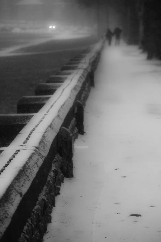 a person walks down a snow covered road