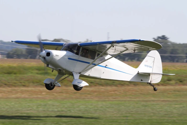 a single prop plane taking off from an airport