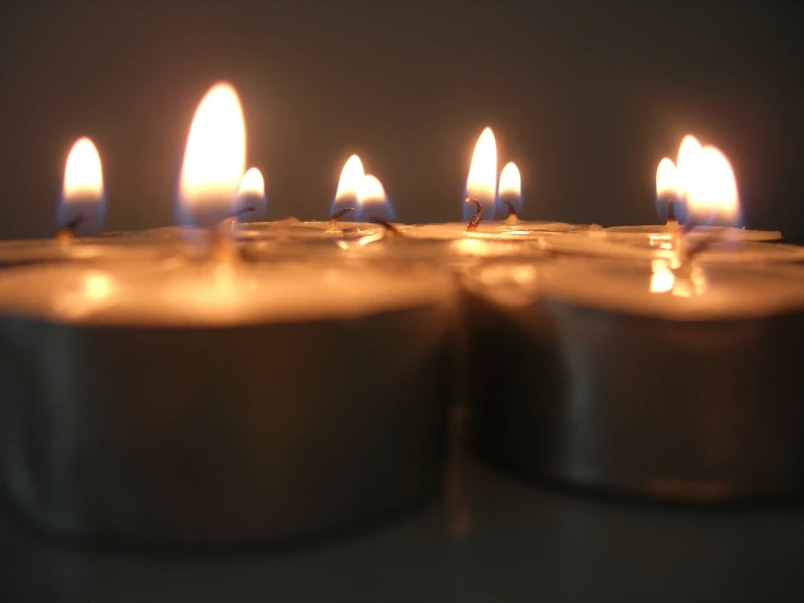 rows of candles lit up in an arranged formation