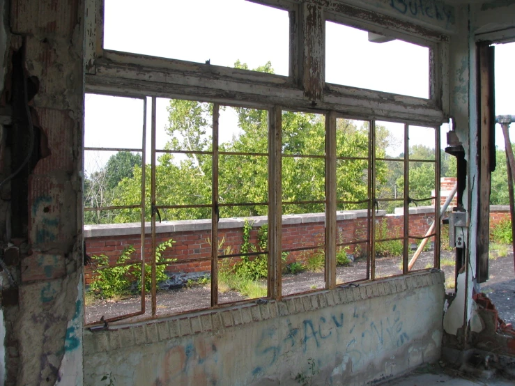 old window frames are seen at the top of a run down building