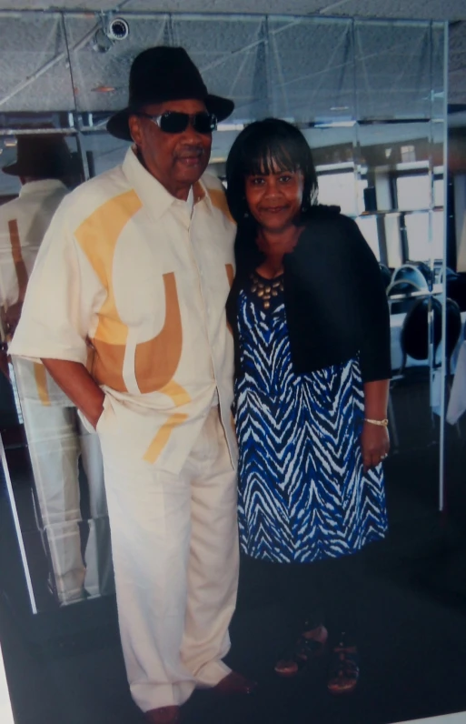 a man and woman in matching clothes at a fashion event