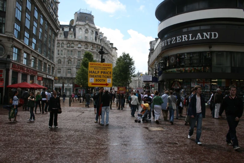 many people are walking and shopping on the street