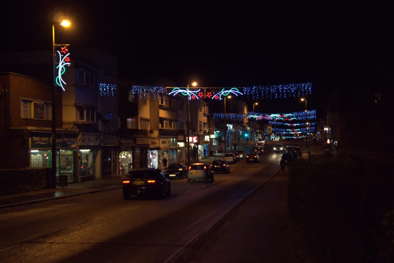 a busy street with many cars and lights