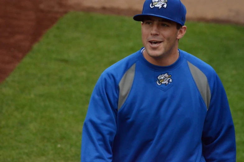 a baseball player has an onlooker talking to his team