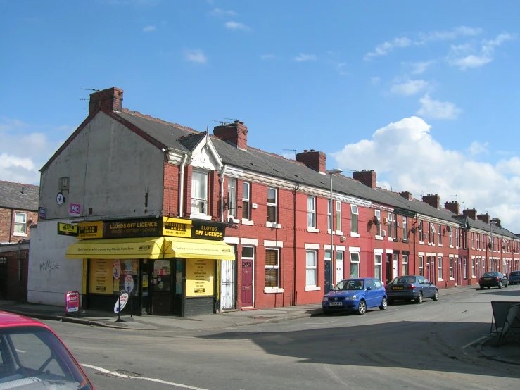 a building is along the street in an older city