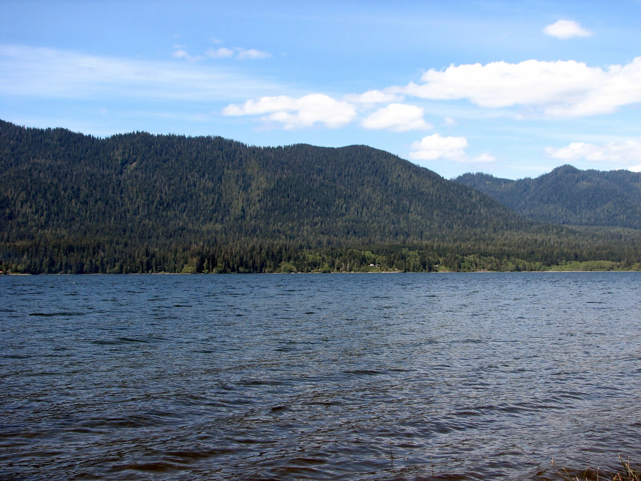 a view of the mountain range from a lake