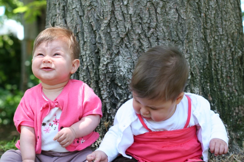 a  and a little girl sitting together