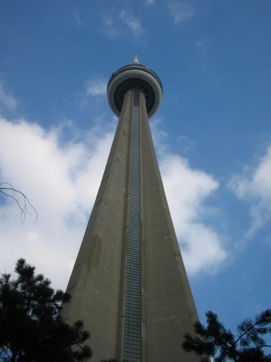 the top of a skyscr with a clock built into it