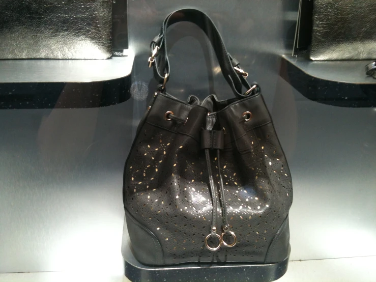 a black purse with silver decorations on it