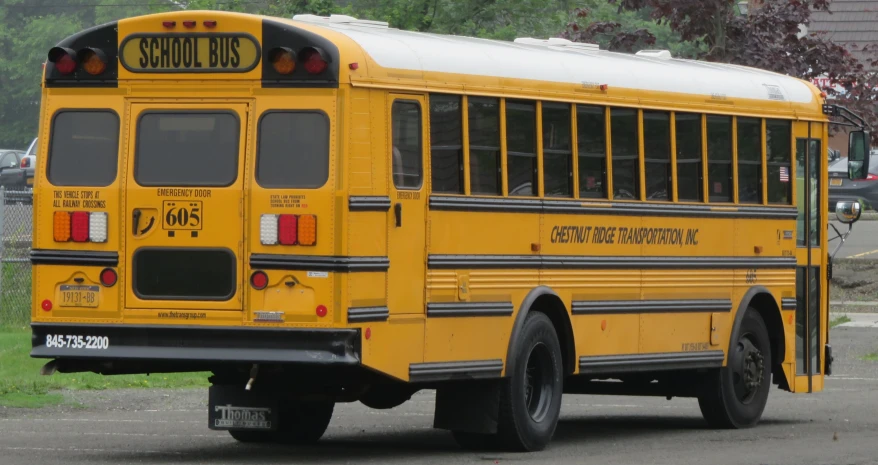 a large yellow school bus parked in a parking lot