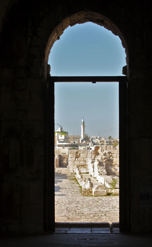 the view from inside a building with a tower