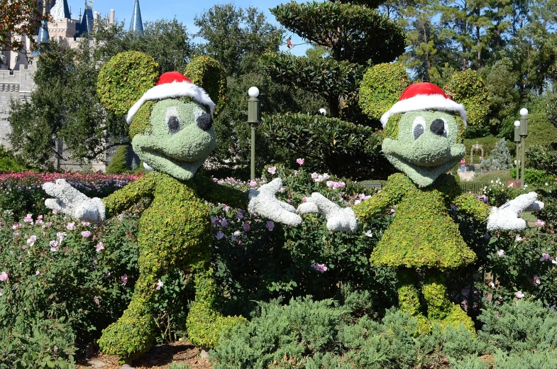 some plants with people in costume in a flower field