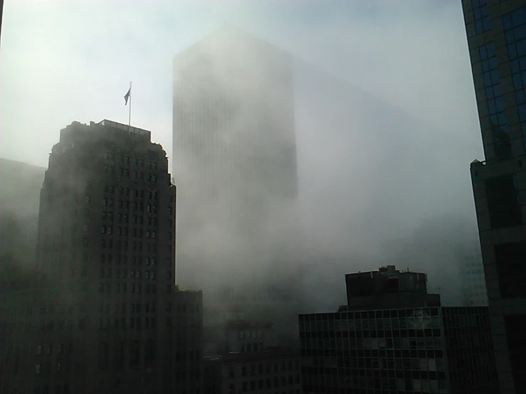 dark skyscrs sit under the dense cloud of smog