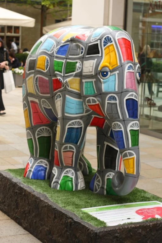 the elephant statue has many colors on it