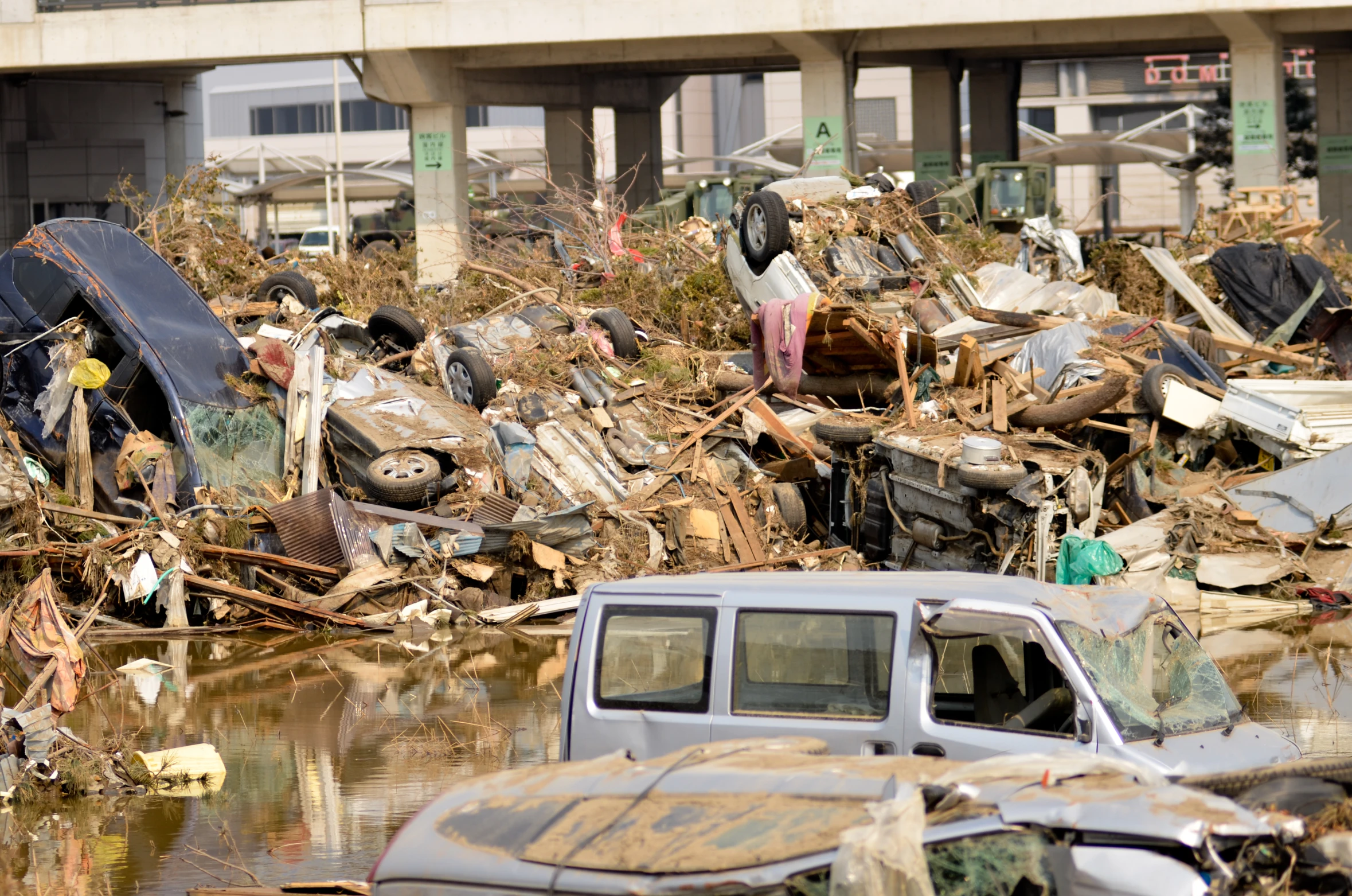 a pile of old vehicles and junk from the street