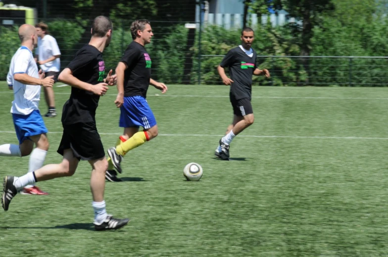 s on a soccer field playing soccer